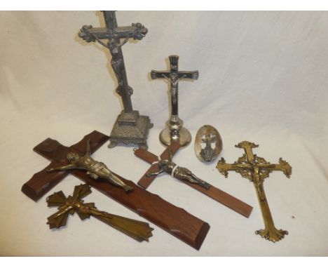 A selection of various crucifixes including nickel and mother-of-pearl wall font, various wall mounted crucifixes and others 