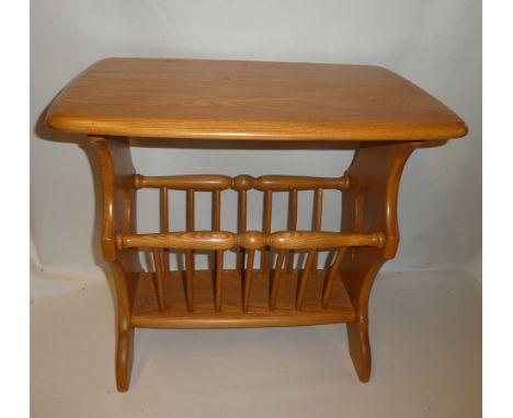 A small Ercol light elm rectangular occasional table with magazine rack base 21" x 13½"