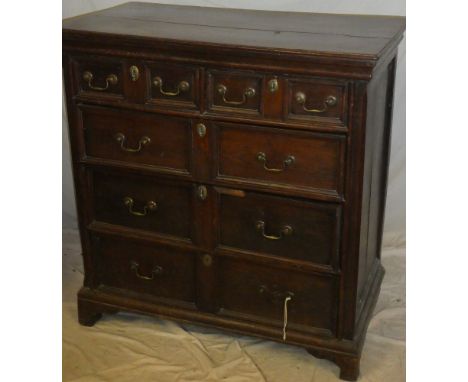 An old oak chest of drawers in the Charles II-style with two drawers in the frieze above three graduated long drawers with br