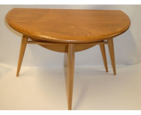 An Ercol light elm circular single drop-leaf occasional table on tapered legs 24" diameter