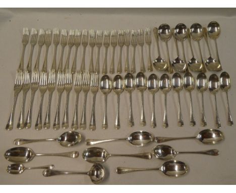 A part set of George V silver table cutlery comprising ten dinner forks, eighteen dessert forks, eight soup spoons, eleven de