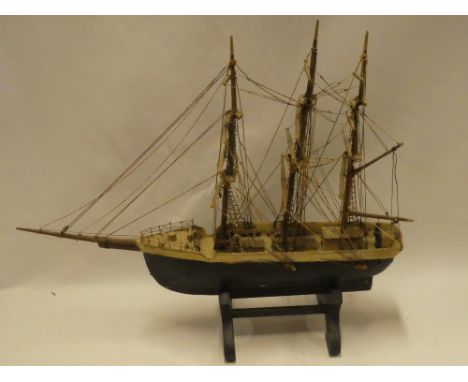 A 19th century wooden scale built model of a three-masted sailing boat 21" long overall