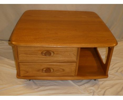 A good quality Ercol light elm square coffee table with two small drawers and open recesses 31" x 31"
