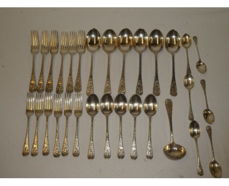 A part set of Victorian table cutlery comprising six silver serving spoons, the handles decorated with figures of Neptune, si