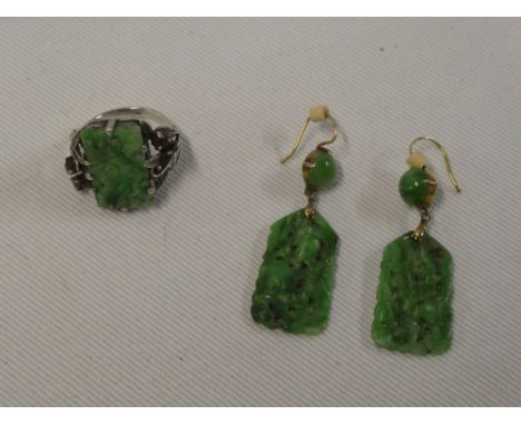 A pair of good quality Eastern carved jade droplet earrings together with a similar dress ring with carved jade panel