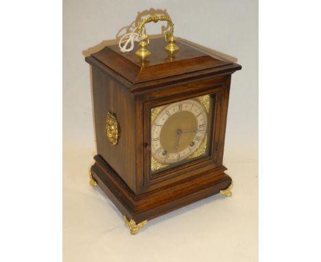 A good quality chiming bracket clock with gilt and silvered square dial in brass mounted oak traditional case