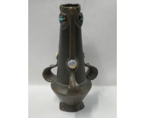 An unusual Art Nouveau bronze pottery tapered three handled vase by Bretby with raised cabochon emblems 12½" high