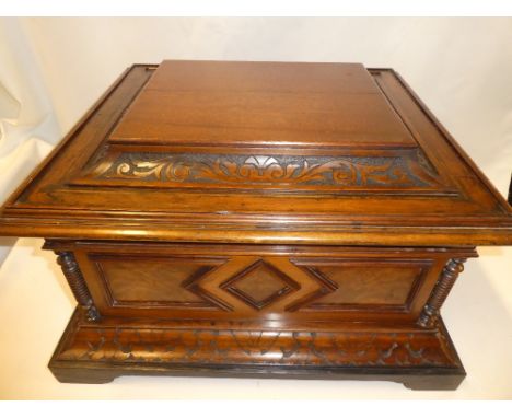 A Victorian polyphon to play 15½" discs in polished and carved burr-walnut rectangular brass mounted cabinet 22" wide x 13½" 