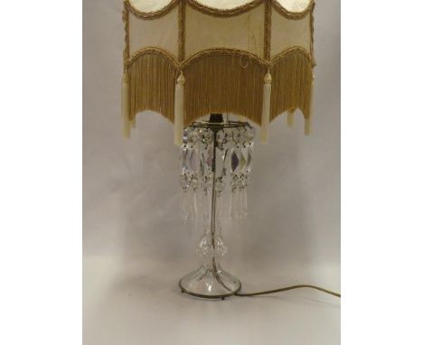 A good quality cut glass and brass mounted table lamp with lozenge droplet decoration