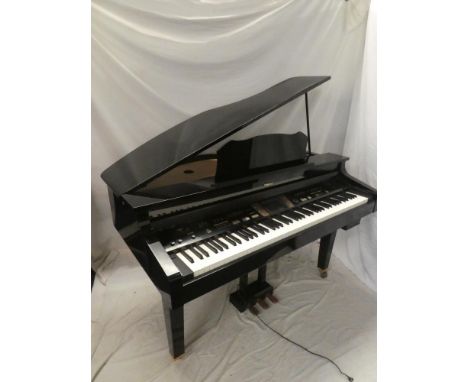 A Roland KR-15 digital grand piano in black finished case with matching stool and owner's manual