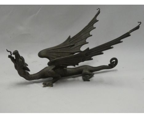 An unusual bronze figure of a winged dragon, 14" long