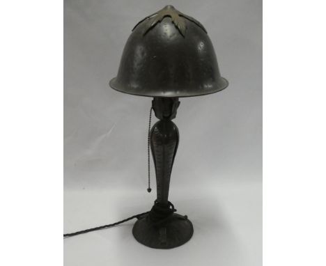 A good quality bronze strawberry pattern table lamp and shade on tapered base