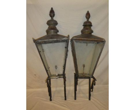 A pair of old copper traditional lantern tops by Foster and Pullen of Bradford with sloping glazed sides and iron wall mounte