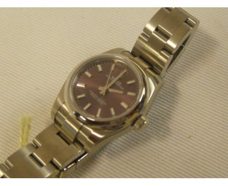 A ladies Rolex Oyster Perpetual Superlative chronometer wristwatch in stainless steel mounts, unused, model 176200 (red grape
