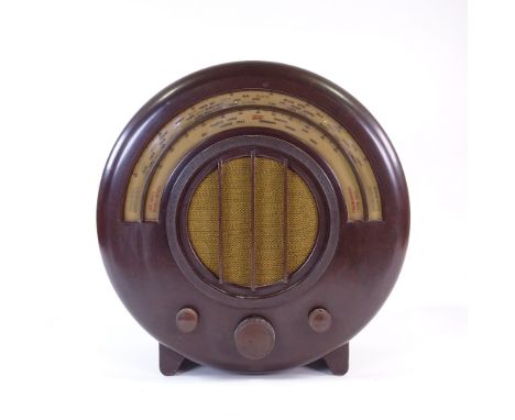 An EKCO model AD65 wood-effect Bakelite radio, 1934, designed by Wells Coates for E K Cole Ltd, height 16"