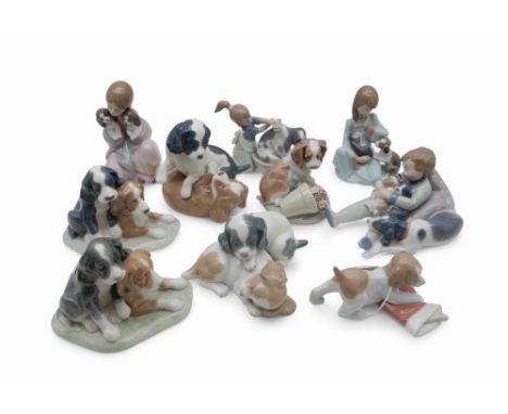 A collection of Lladro and Nao puppy groups (10) Condition Report:Available upon request