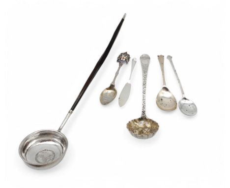 A collection of silver and white metal including a George III toddy ladle, a silver sifter ladle with later decoration, a sil