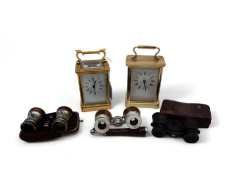A brass and glass cased carriage clock with roman numerals to the dial, a battery operated example together with three pairs 