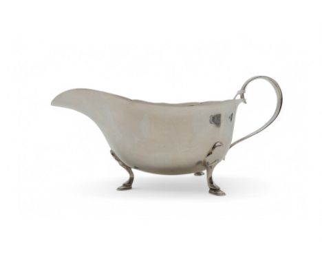 A silver sauce boat, by Mappin & Webb, Sheffield 1961, with a shaped rim, upon three hoof feet, 116gms Condition Report:Avail