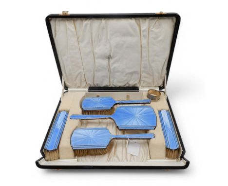 A cased guilloche enamel silver dressing set, by Henry Clifford Davis, Birmingham 1936, comb missing and a silver napkin ring