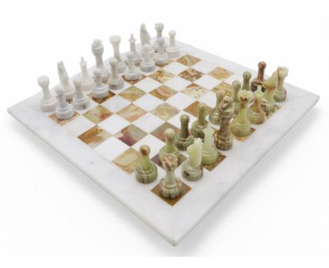 An onyx chess set, with board measuring approx. 40.5cm x 40.5cm, the kings approx. 9cm in height, housed in a fitted case Con