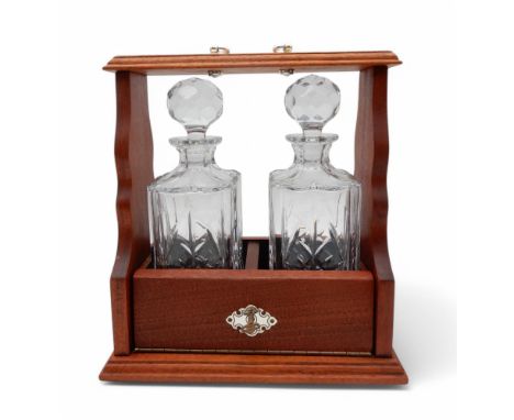 A Two decanter tantalus, with silver plated mounts Condition Report:Available upon request