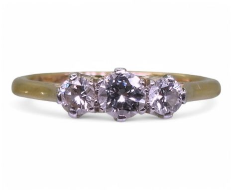 An 18ct and platinum three-stone diamond ring, size K, set with an estimated approx. 0.33ct brilliant cut diamonds, weight 2.