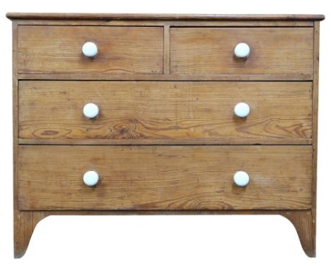 An early 20th century pitch pine two over two chest of drawers with ceramic drawer knobs on bracket feet, 85cm high x 110cm w