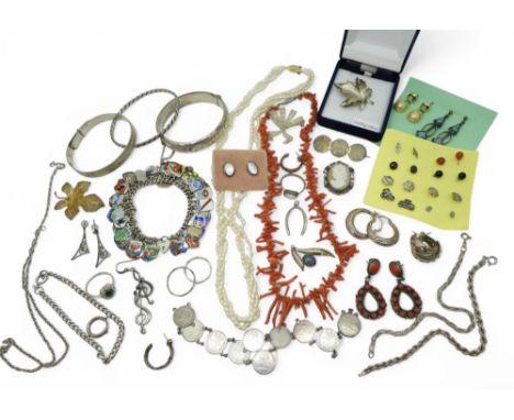 A collection of silver and costume jewellery to include a string of coral fringe beads, a pair of Navajo coral set earrings, 