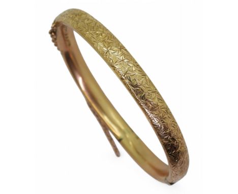 A 9ct gold ivy pattern bangle, hallmarked Birmingham 1907, weight 9.1gms Condition Report:various shallow dents can be felt r