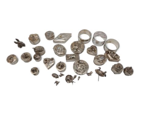 A collection of plated Silver scenes trinket boxes and pill boxes, a pewter rabbit, three silver napkin rings, 67gms (qty) Co