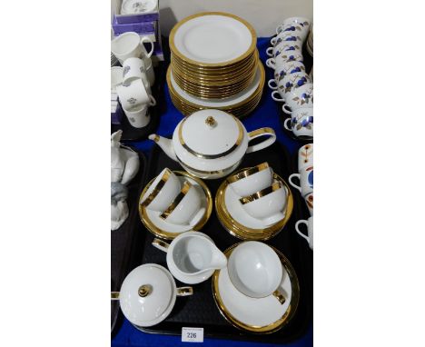 A Ralph Lauren Academy tea and dinner service, with gold plated rims comprising teapot, five cups and saucers, seven side pla