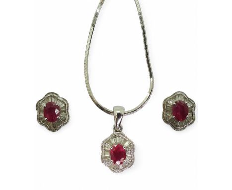A ruby &amp; diamond suite, the earrings set with oval cut rubies of approx 5mm x 4mm, surrounded with tapered baguette cut d