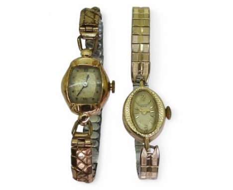 A 14k gold ladies Universal Geneve watch head with a gold plated strap, a 14k gold ladies watch head with Swiss movement and 