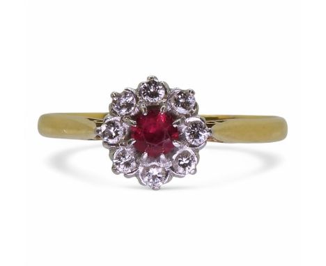 An 18ct gold ruby&nbsp; and diamond flower ring, size U, weight 2.7gms Condition Report:Available upon request