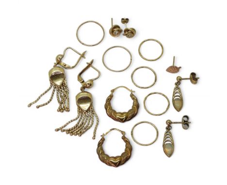 A collection of 9ct gold and yellow metal earrings to include a pair of 9ct opal set peacock feather design and various hoops