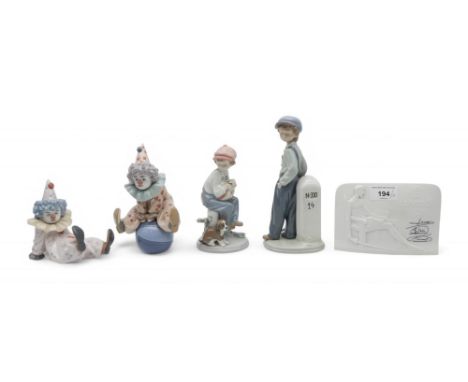 Two Lladro clowns, two other figures and a plaque Condition Report:Available upon request