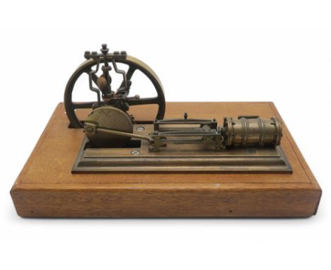 A live steam piston engine, of heavy brass construction, mounted on a plinth base measuring approx. 41.5cm x 25cm, with vario