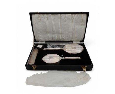 A cased silver dressing set, by B * Co, Birmingham, with engine-turned decoration, monogrammed Condition Report:Available upo