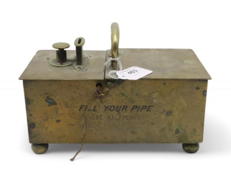 A brass mechanical tavern tobacco box, the front face engraved "Fill Your Pipe, One Halfpenny", the righthand lid engraved "J