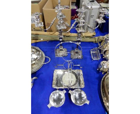 A pair of EPNS three light candelabra, two quaichs with celtic knotwork decoration, a swing-handled basket, a glass and EPNS 