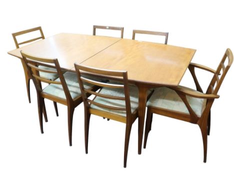 A mid 20th century teak dining suite consisting extending dining table with internal leaf on shaped supports, 75cm high x 153