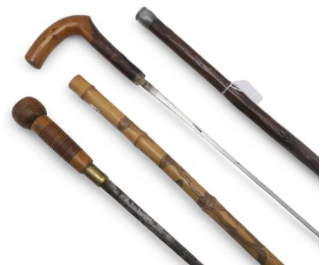 A sword stick, concealing an approx. 60cm stiletto blade marked "Solingen"; together with another (2)Note: An age verificatio