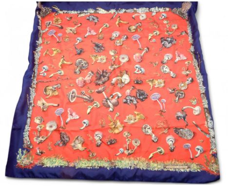 A Hermes&nbsp;Champignons (Mushroom) silk scarf, on red ground with royal blue border Condition Report:Available upon request