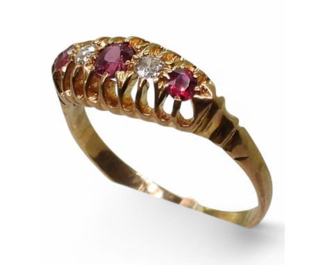 An 18ct gold ruby and diamond ring, size O, weight 2.4gms Condition Report:The hallmark has pretty much gone but you can just