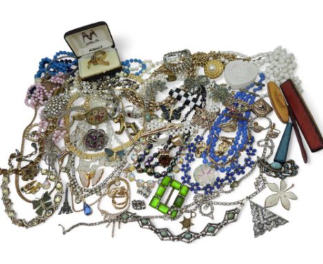 A large collection of costume jewellery to include items by Sarah Coventry, vintage diamante, beads, peacock beads and brooch