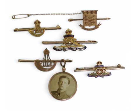 A 9ct gold Royal Army Ordnance Corps sweetheart brooch; together with two 9ct Durham Light Infantry brooches, one suspending 
