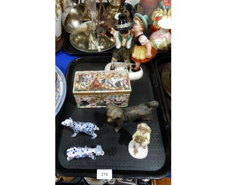 A Delft dog and cow, a porcelain monkey band figure, a bronze dog, a Capodimonte rectangular box and a Austrian Keramos figur