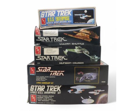 Five Ertl AMT Star Trek model kits, comprising the U.S.S. Enterprise, Vulcan Shuttle, Klingon Cruiser and 3-piece U.S.S. Ente