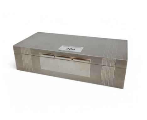 A silver cigarette box, by A. Wilcox, Birmingham 1950,&nbsp; with engine-turned banded decoration, 19 x 9 x 5cm Condition Rep